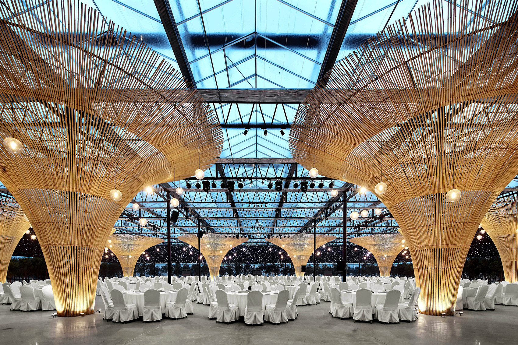MIX Architecture renovated the sun shed of Chun Qin Yuan Ecological Farm into a large hall for various activities with tree-like pillars