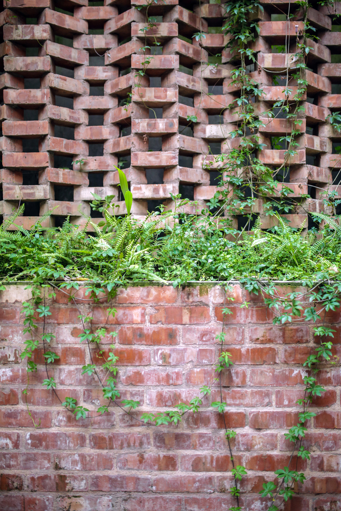 Walls of local bricks are the right material for the design concept to blend with nature
