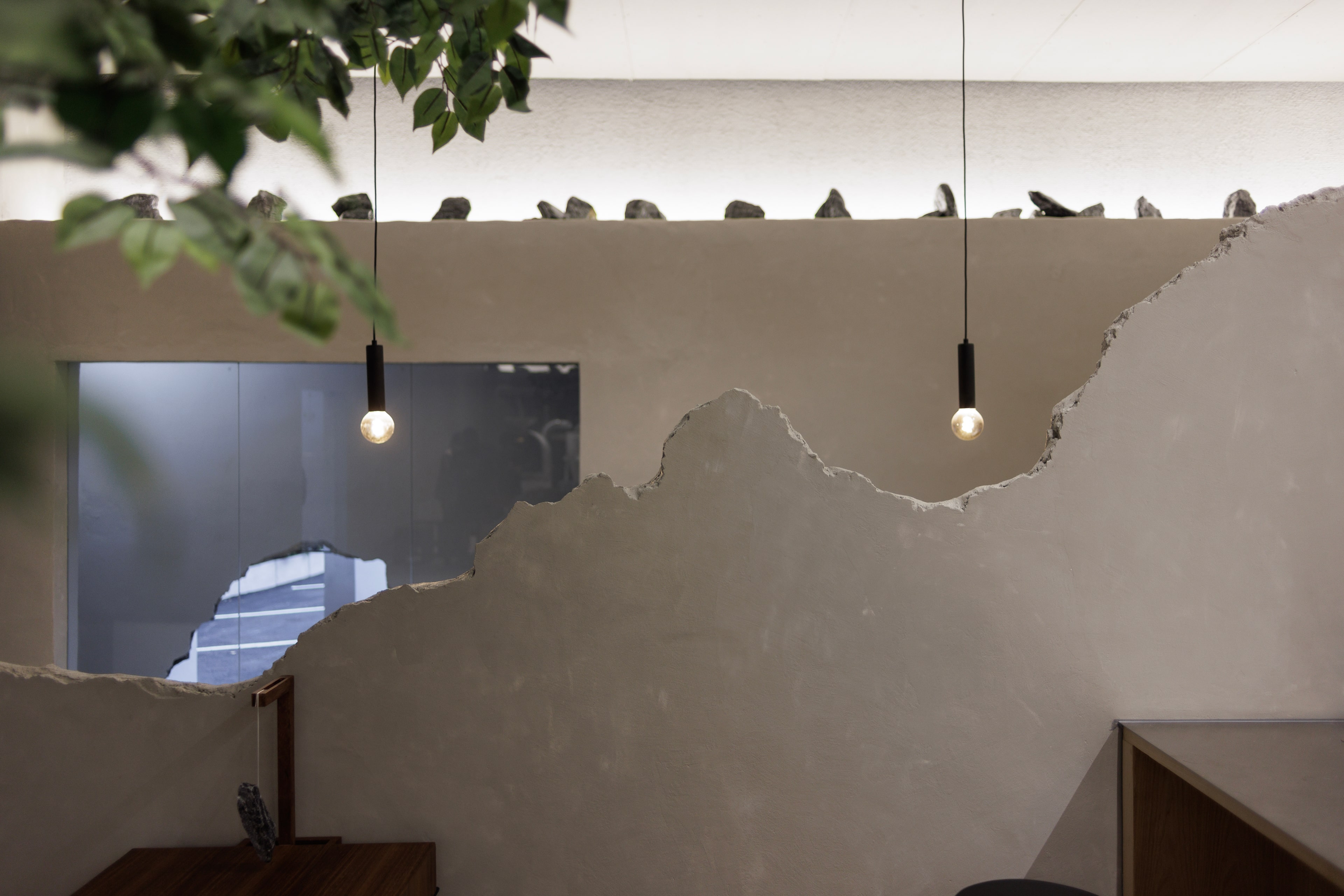 An incomplete wall separating the two areas in the café's interior