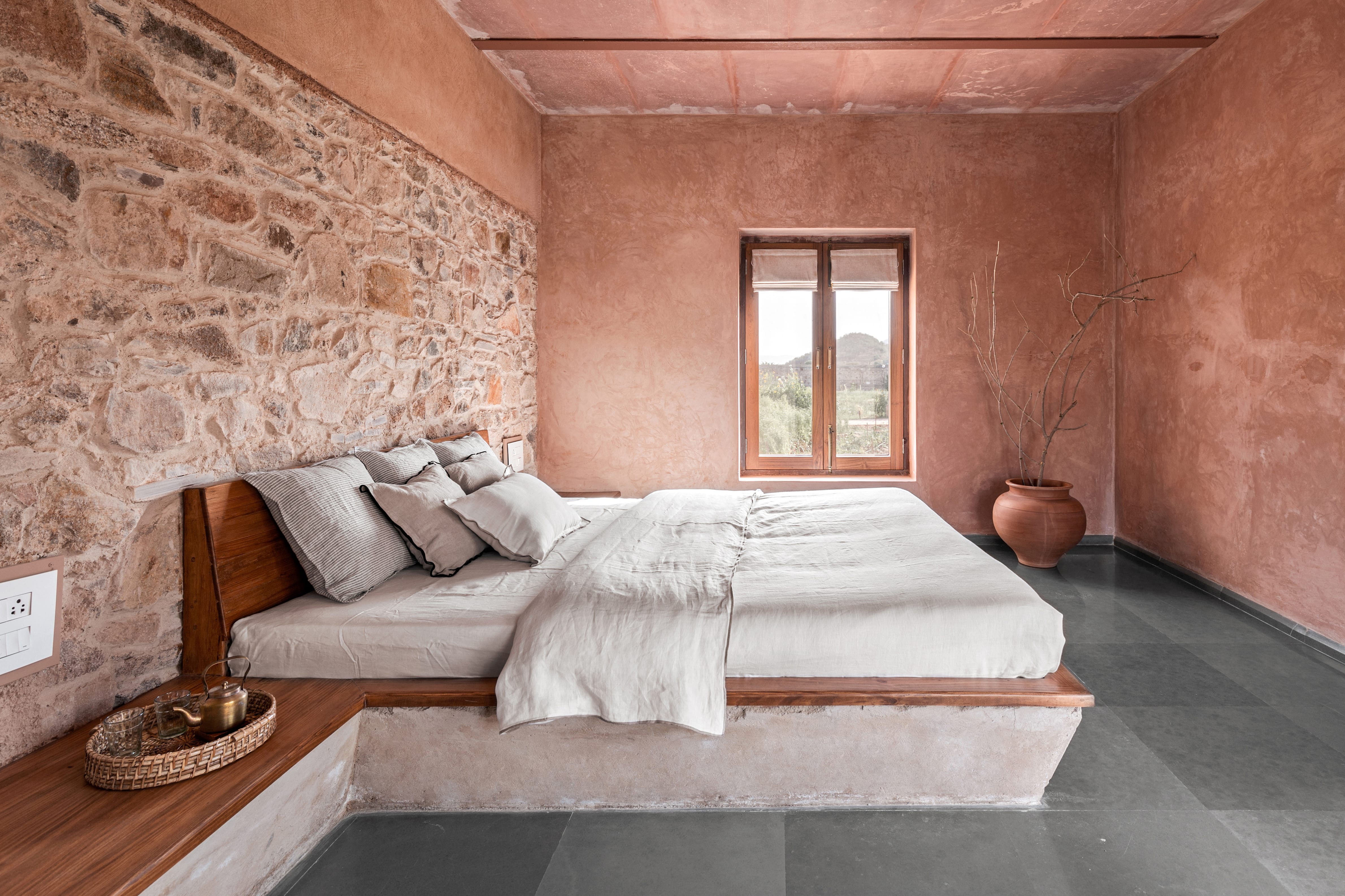 In the other bedroom, you can see the combination of two walls with different materials as the interior