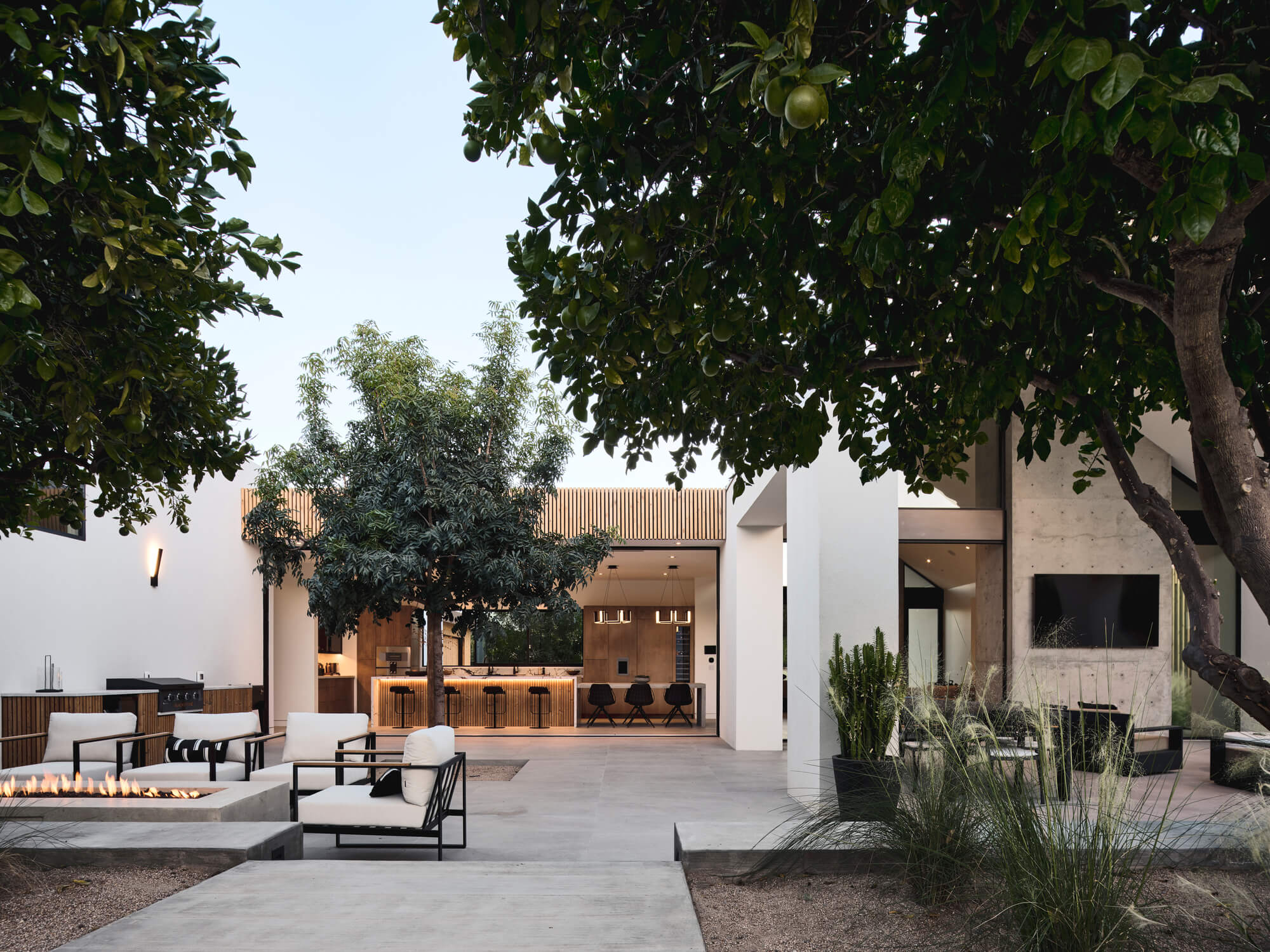 The building stretches to direct residents and guests into the courtyard plan of the central communal area