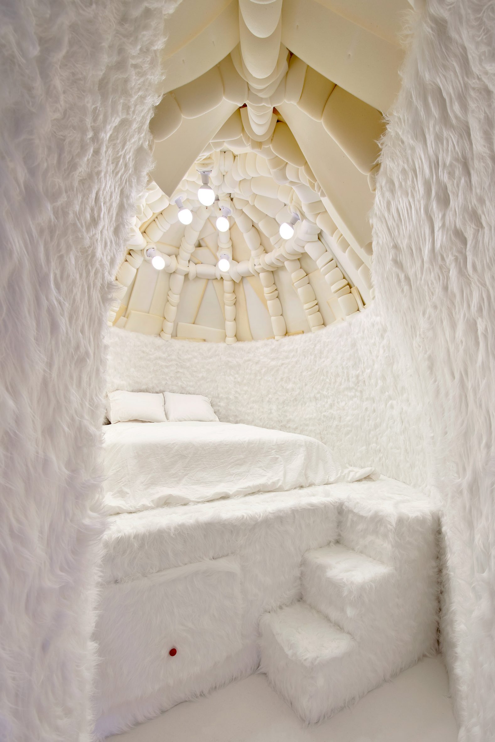 The mattress in the igloo is large enough so that underneath it can be used for storage, playing, and hiding