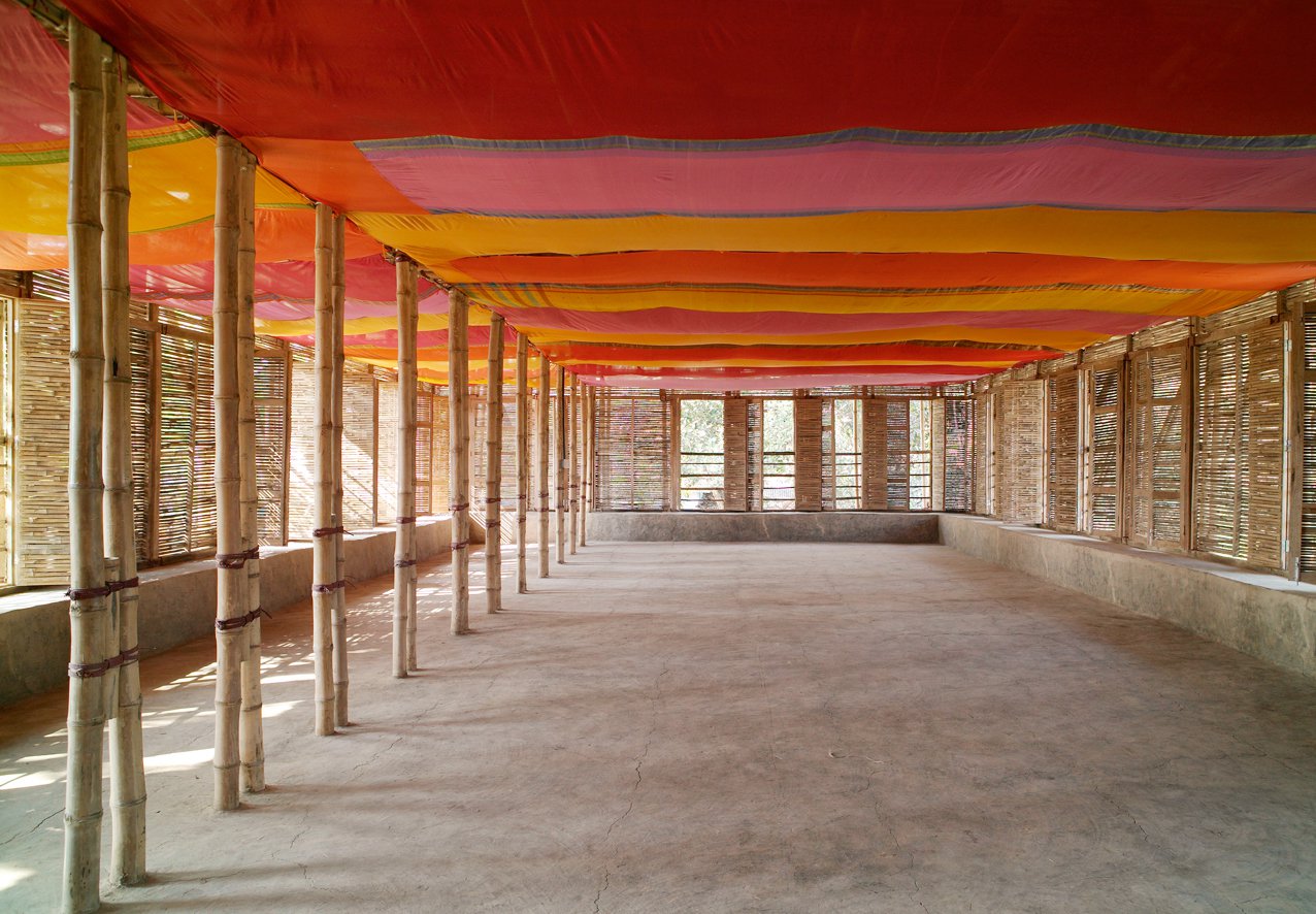 light is contrasts with the colors of the sari on the ceiling