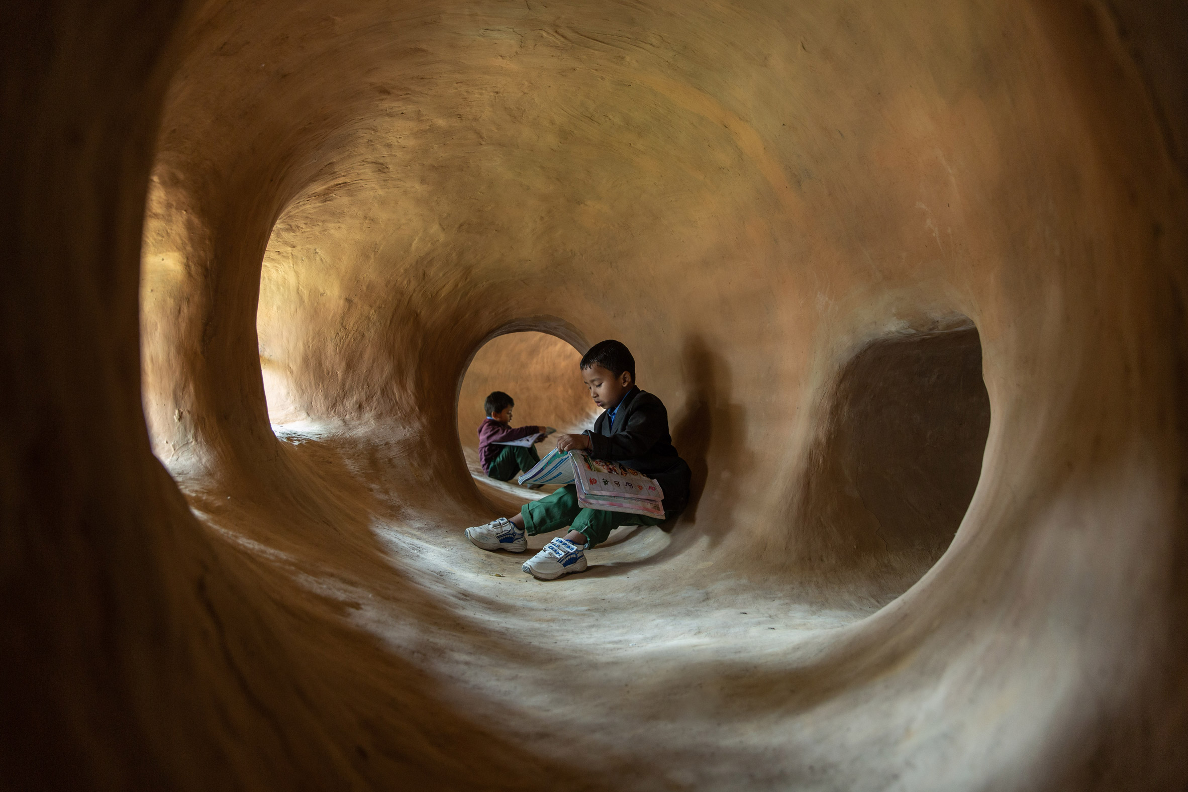 Each classroom has open access to a 'cave' system
