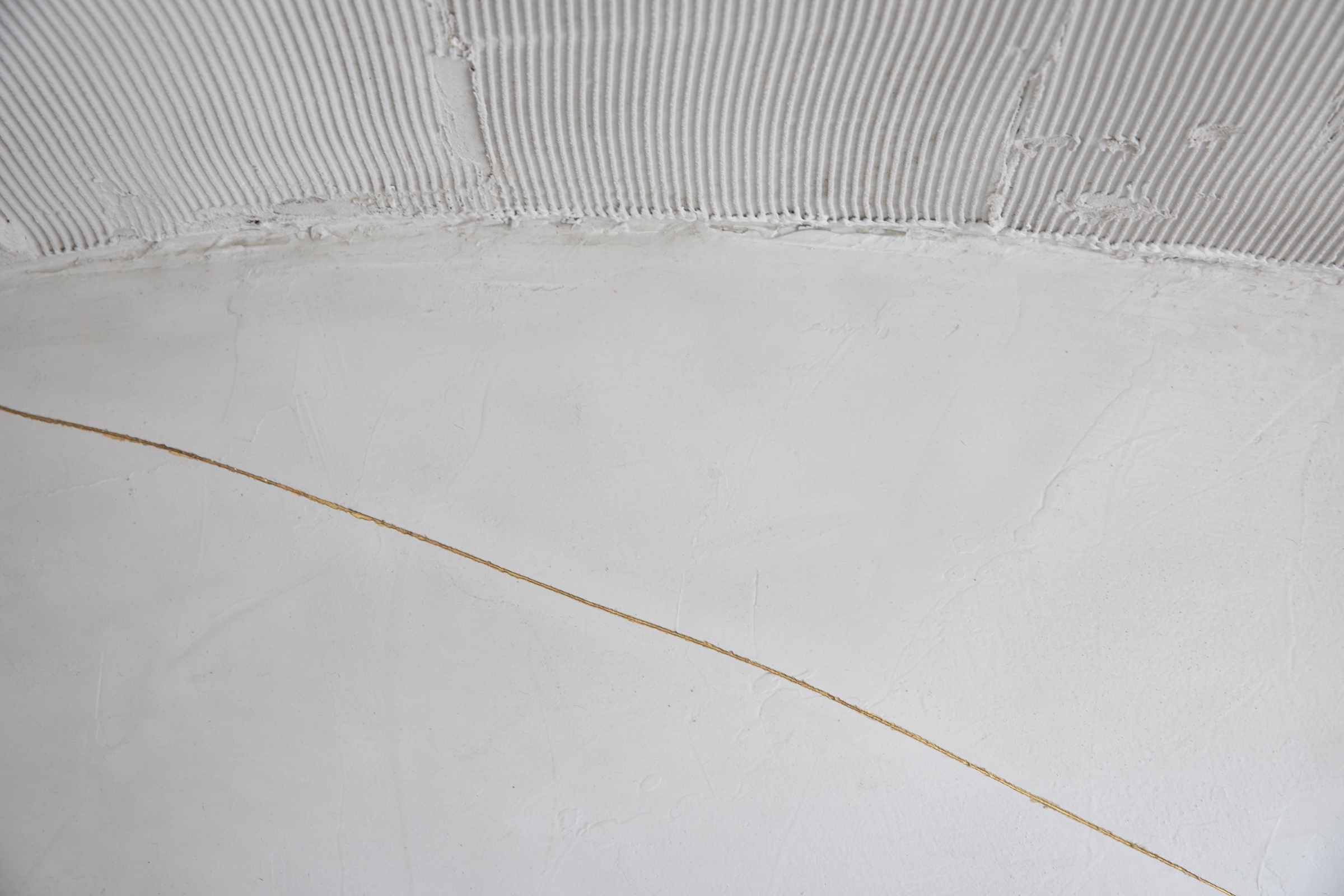 Details of cracks in the floor that emerged from the construction process of the Selo Store